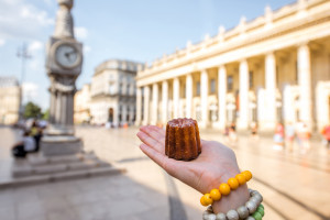 Bordeaux local eats Cannele small cylindrical sweet cake outside Grand Theatre de Bordeaux France AdobeStock 163780769 web