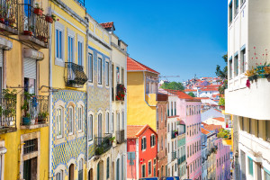 Lisbon Alfama district colorful buildings near Rossio Square Portugal AdobeStock 250335508 web