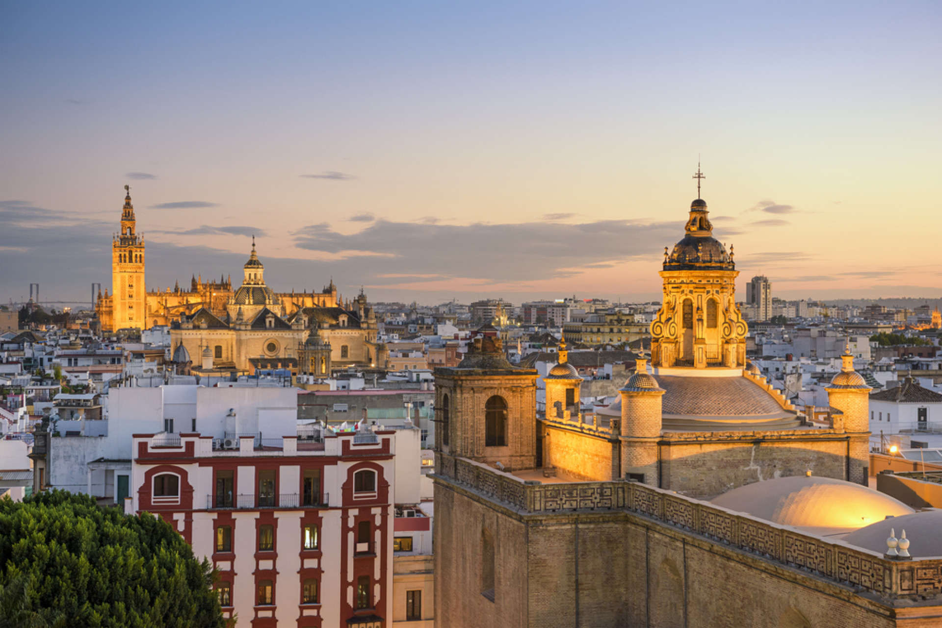 Seville Spain city skyline at dusk.